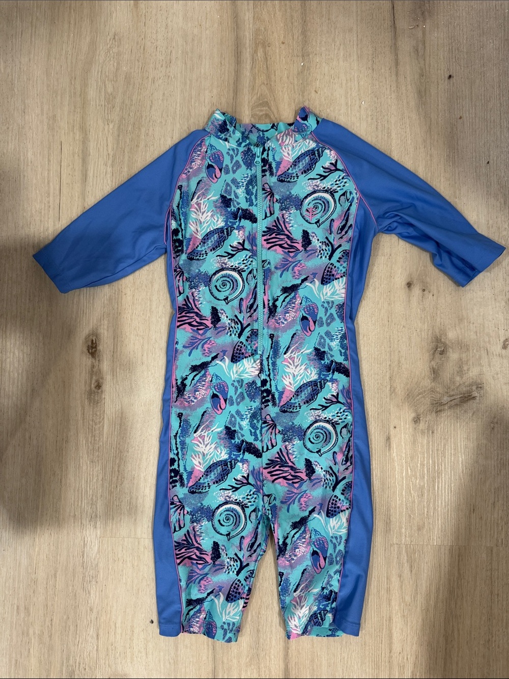 Coolibar toddler girl neck to knee Blue Seashell Print Zip-Front swimwuit